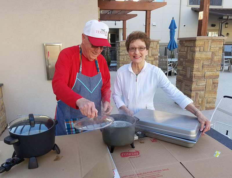 Active adult community residents participate in a cooking event