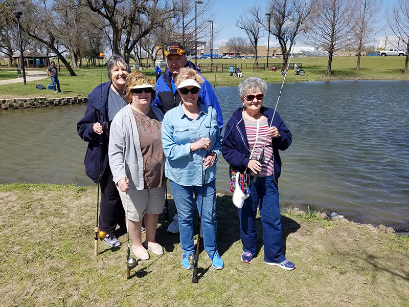 Senior living residents at a fishing outing